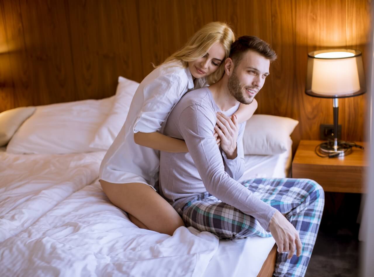 lovely-couple-hugging-on-their-bed-at-home-2023-11-27-05-35-08-utc (2)