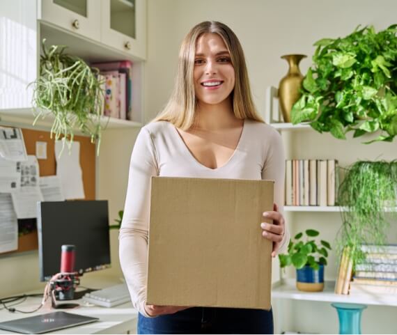 young-woman-at-home-unpacks-cardboard-box-with-onl-2024-12-08-05-26-44-utc (3)