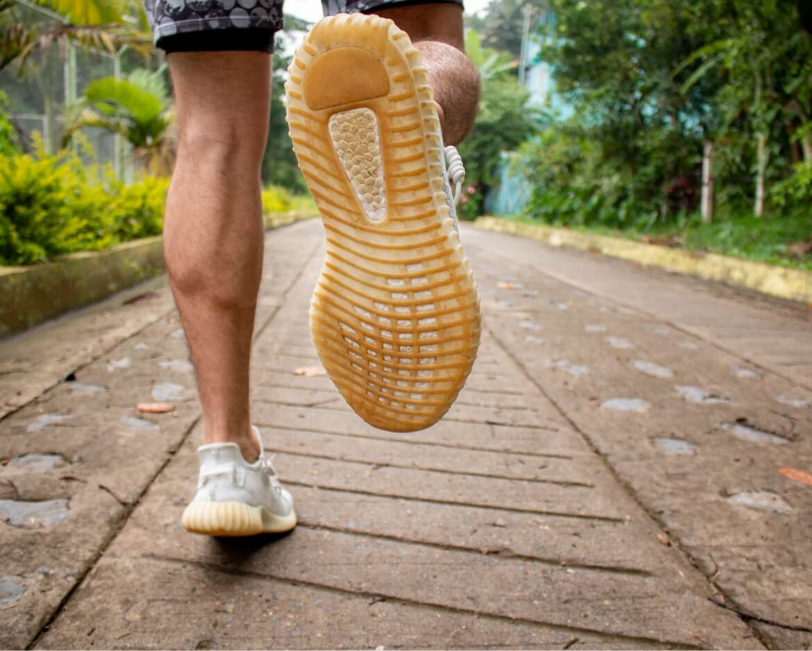 close-up-of-a-man-s-legs-jogging-or-running-in-sne-2024-12-06-19-41-10-utc-1