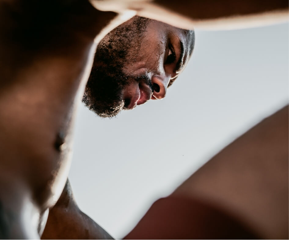 low-angle-portrait-of-sweaty-african-runner-restin-2025-01-09-06-16-46-utc-1