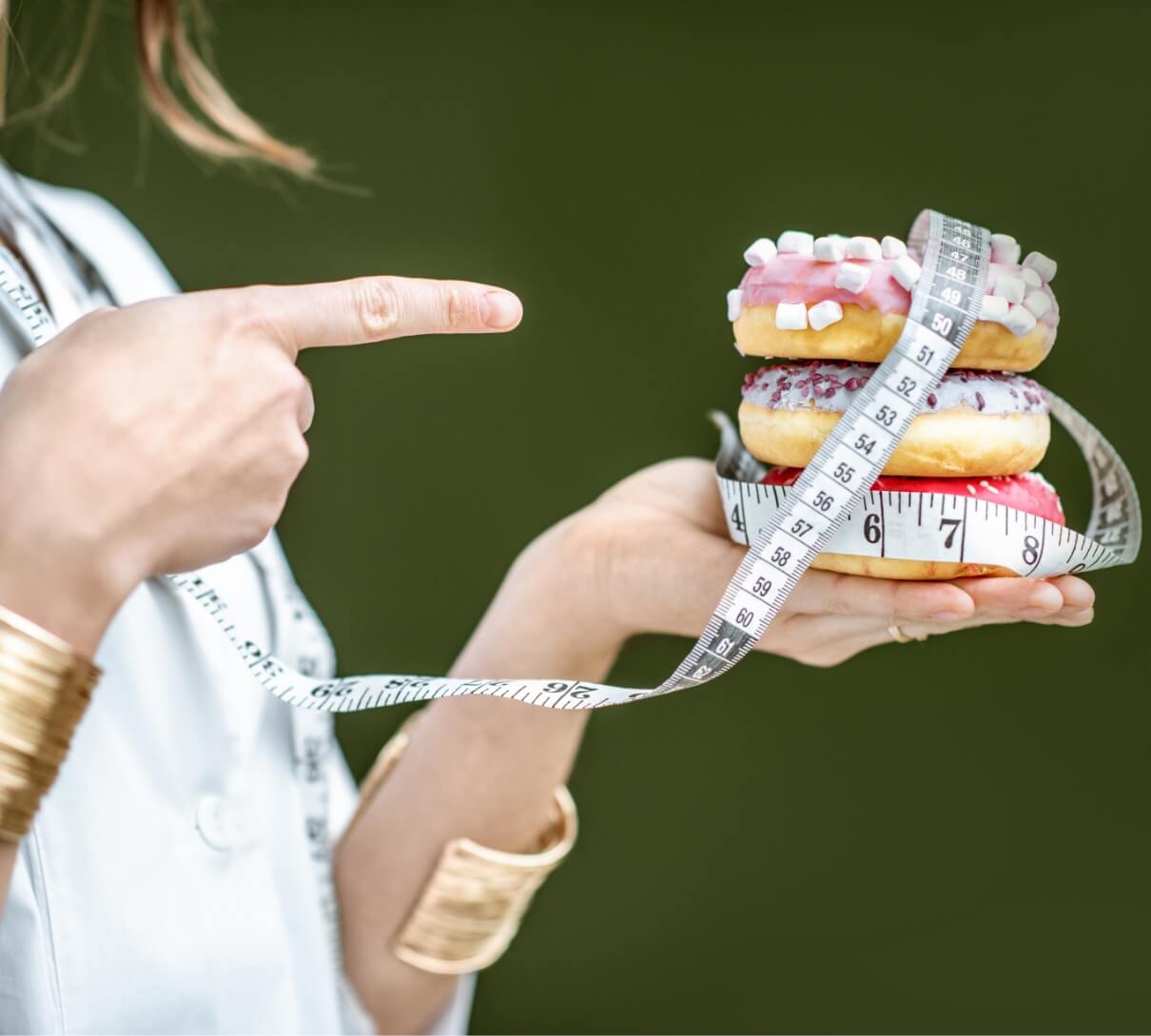 nutritionist-with-unhealthy-donuts-2023-11-27-04-57-46-utc-1